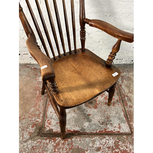 128 - A Victorian stained elm and beech farmhouse armchair