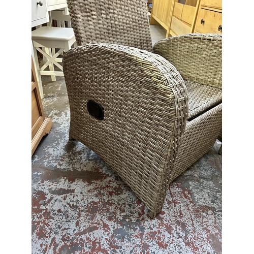 130 - A plastic rattan effect reclining garden sun lounger armchair