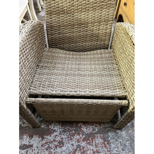 130 - A plastic rattan effect reclining garden sun lounger armchair