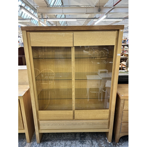 148 - A Scandinavian Karel Mintjens oak two door glazed display cabinet  - approx. 186cm high x 128cm wide... 