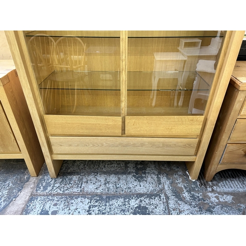 148 - A Scandinavian Karel Mintjens oak two door glazed display cabinet  - approx. 186cm high x 128cm wide... 