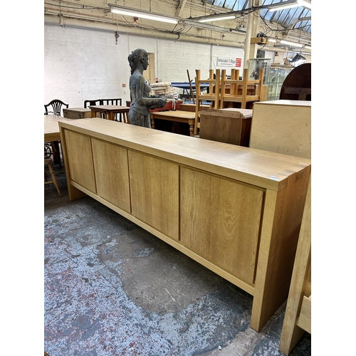 149 - A Scandinavian Karel Mintjens oak four door sideboard - approx. 91cm high x 243cm wide x 45cm deep