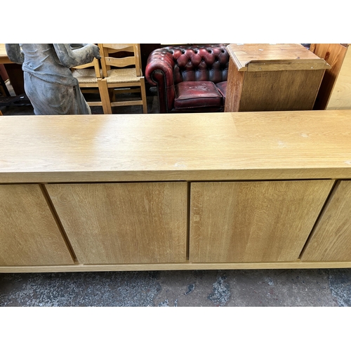 149 - A Scandinavian Karel Mintjens oak four door sideboard - approx. 91cm high x 243cm wide x 45cm deep