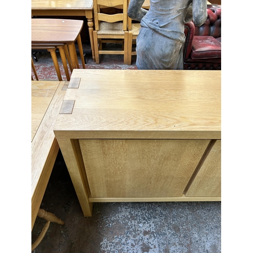 149 - A Scandinavian Karel Mintjens oak four door sideboard - approx. 91cm high x 243cm wide x 45cm deep