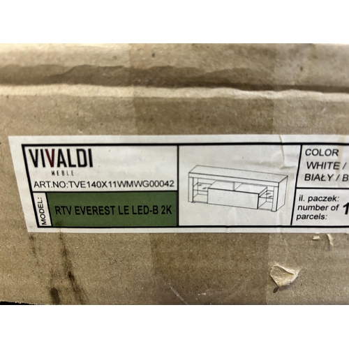 15 - A boxed Vivaldi white TV stand