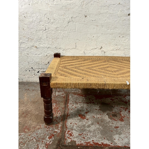 150 - A South Asian traditional woven and hardwood charpai - approx. 40cm high x 60cm wide x 110cm long