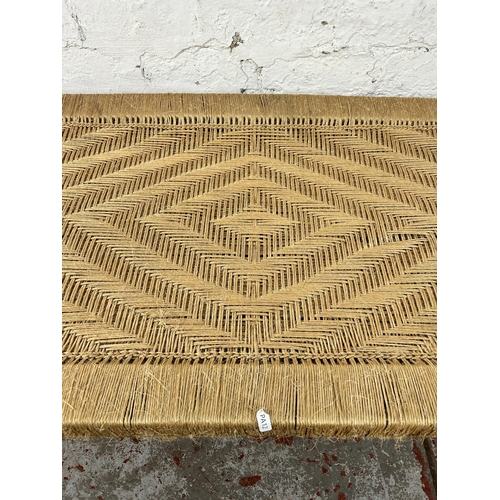 150 - A South Asian traditional woven and hardwood charpai - approx. 40cm high x 60cm wide x 110cm long