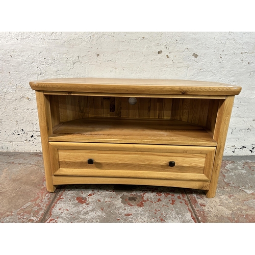 156 - A modern solid oak TV stand