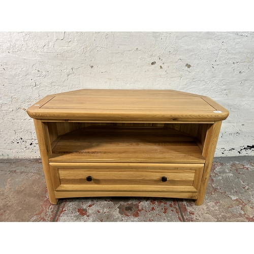 156 - A modern solid oak TV stand