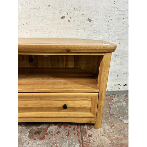 156 - A modern solid oak TV stand