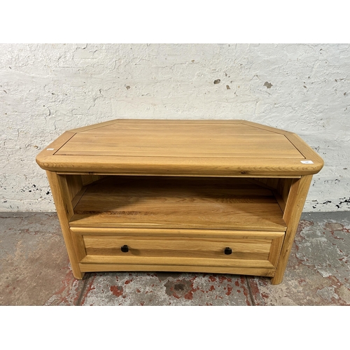 156 - A modern solid oak TV stand