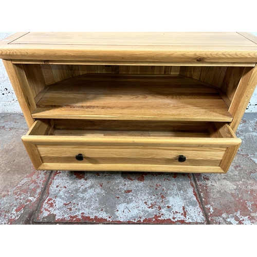 156 - A modern solid oak TV stand