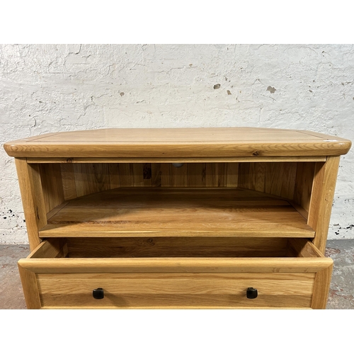 156 - A modern solid oak TV stand