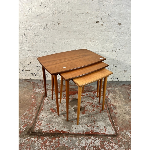 157 - A mid 20th century teak nest of tables