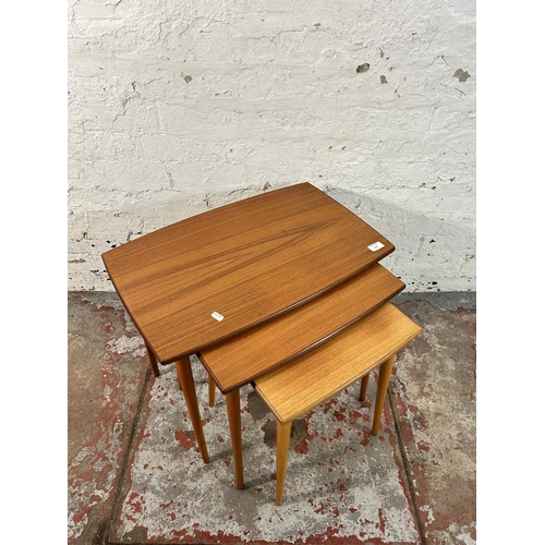 157 - A mid 20th century teak nest of tables