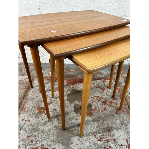 157 - A mid 20th century teak nest of tables