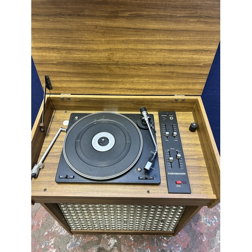 17 - A mid 20th century teak effect cabinet containing Ambassador record player - approx. 82cm high x 61c... 