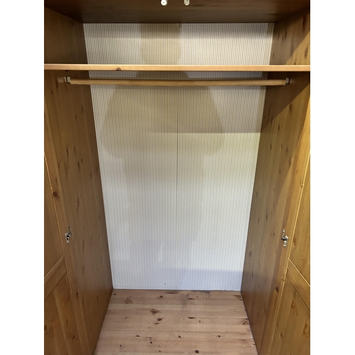 2 - An IKEA pine triple wardrobe - approx. 185cm high x 148cm wide x 62cm deep