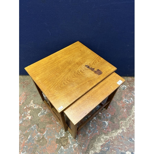 22 - A mid 20th century teak nest of tables