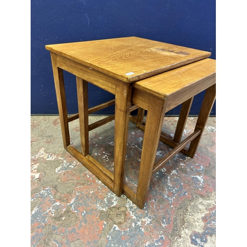 22 - A mid 20th century teak nest of tables