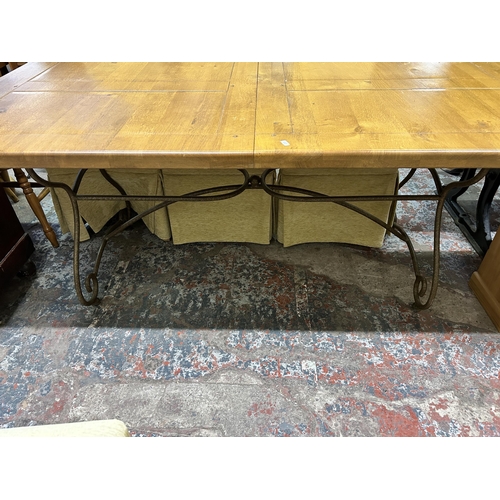 25 - A modern solid oak and wrought iron rectangular dining table and six fabric upholstered dining chair... 