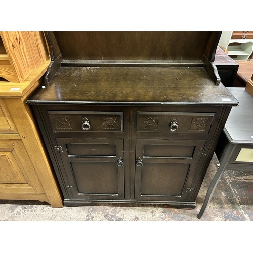 33 - A carved oak dresser - approx. 180cm high x 94cm wide x 48cm deep