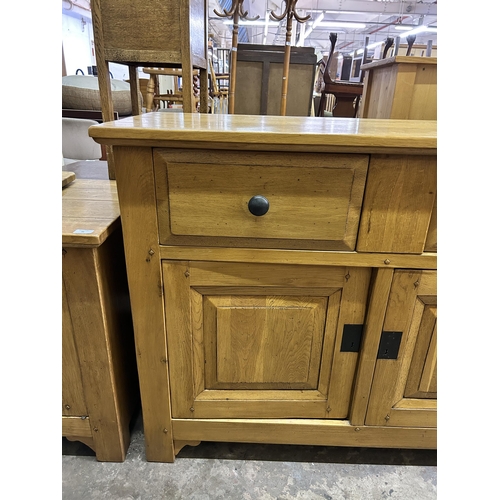 35 - A modern solid oak sideboard - approx. 96cm high x 126cm wide x 48cm deep