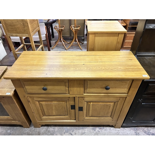 35 - A modern solid oak sideboard - approx. 96cm high x 126cm wide x 48cm deep