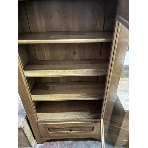 37 - A modern solid oak display cabinet - approx. 171cm high x 98cm wide x 41cm deep