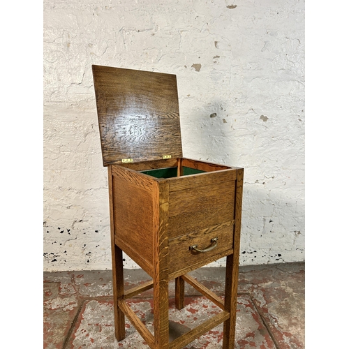 40 - A 1930s oak sewing table - approx. 66cm high x 32cm wide x 31cm deep