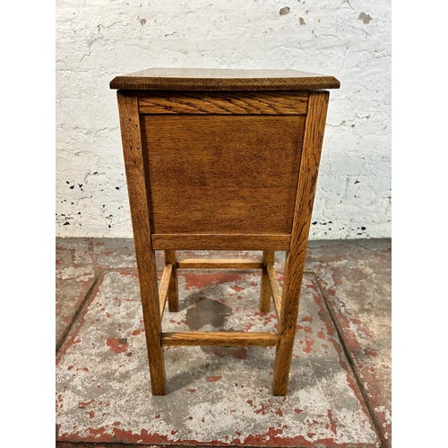 40 - A 1930s oak sewing table - approx. 66cm high x 32cm wide x 31cm deep