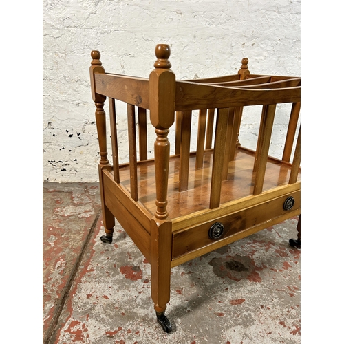 48 - A Regency style yew wood three division Canterbury magazine rack - approx. 53cm high x 50cm wide x 3... 