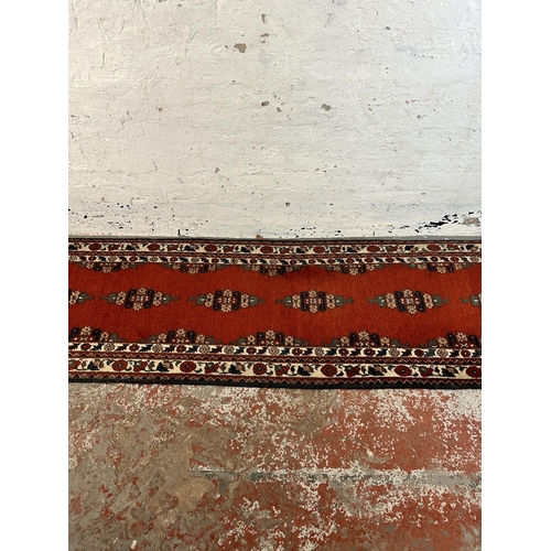 50 - A mid 20th century machine woven hall runner - approx. 300cm x 83cm