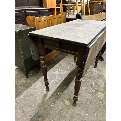 54 - A 19th century stained pine drop leaf Pembroke table