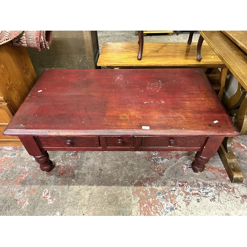 60 - A modern stained pine three drawer coffee table