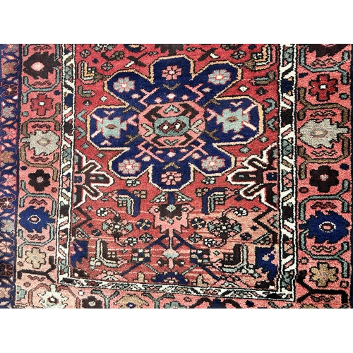 67 - A Taj Abad wool/cotton rug made in Iran - approx. 296cm x 110cm