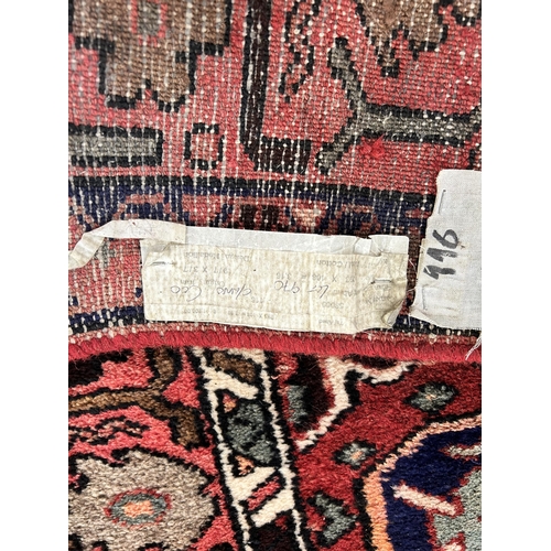 67 - A Taj Abad wool/cotton rug made in Iran - approx. 296cm x 110cm