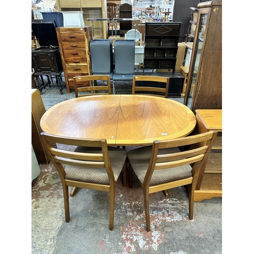 69 - A Nathan teak extending dining table and four chairs - approx. 74cm high x 91cm wide x 135cm long