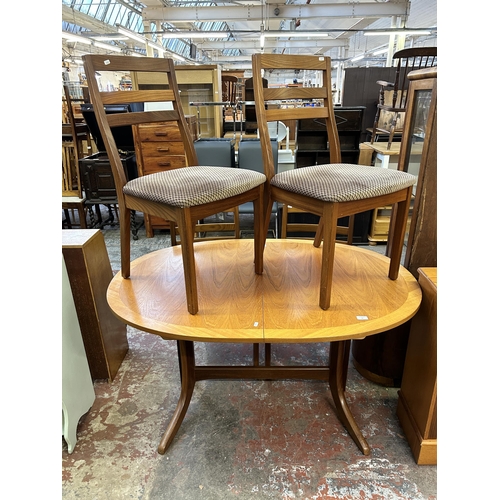 69 - A Nathan teak extending dining table and four chairs - approx. 74cm high x 91cm wide x 135cm long