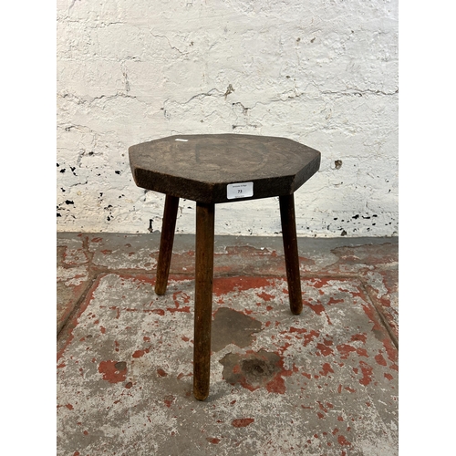 73 - A pokerwork tripod stool - approx. 41cm high