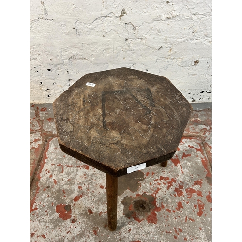 73 - A pokerwork tripod stool - approx. 41cm high