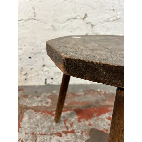 73 - A pokerwork tripod stool - approx. 41cm high