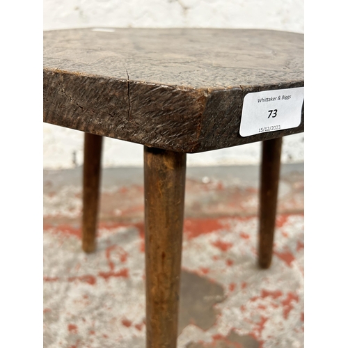 73 - A pokerwork tripod stool - approx. 41cm high