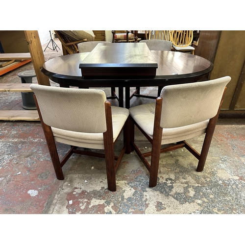 78 - A mahogany extending dining table and four chairs