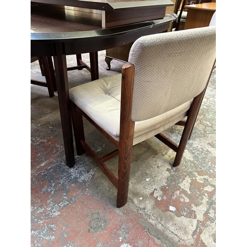 78 - A mahogany extending dining table and four chairs