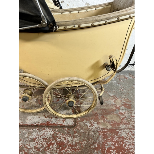 79 - A 1930s cream painted pram - approx. 118cm high x 64cm wide x 137cm long