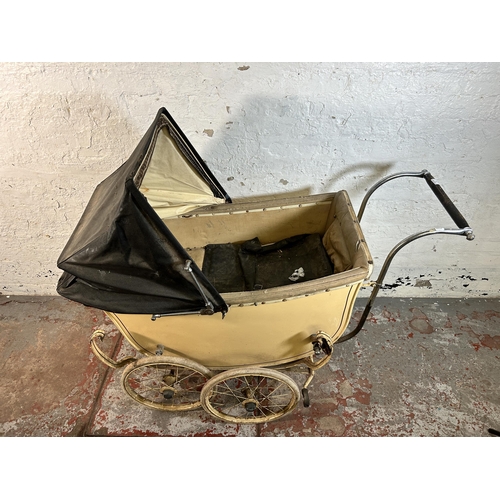 79 - A 1930s cream painted pram - approx. 118cm high x 64cm wide x 137cm long