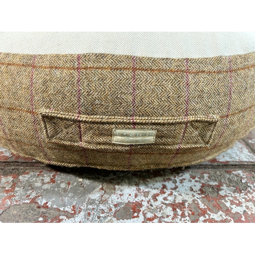 81 - A Voyage Maison tartan fabric upholstered footstool - approx. 80cm in diameter