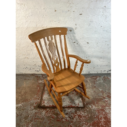 82 - A Victorian style solid beech farmhouse rocking chair