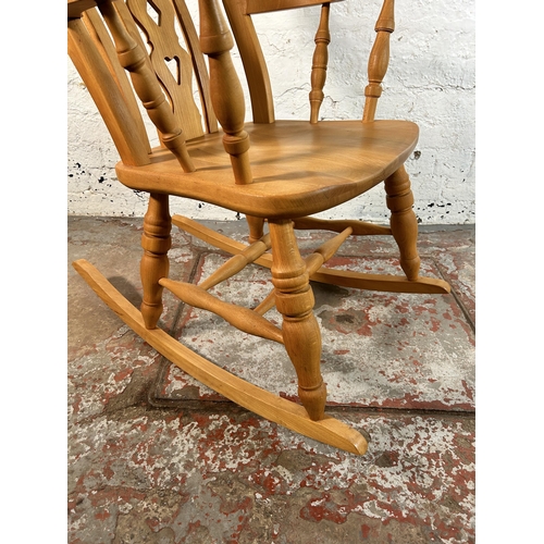 82 - A Victorian style solid beech farmhouse rocking chair